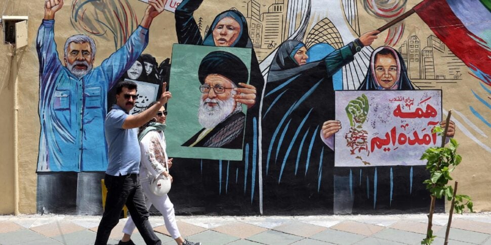 https://gsud.cdn-immedia.net/2026/05/An-Iranian-couple-walks-next-to-a-anti-US-and-Israel-mural-in-a-street-in-Tehran-Iran-970x485.jpg